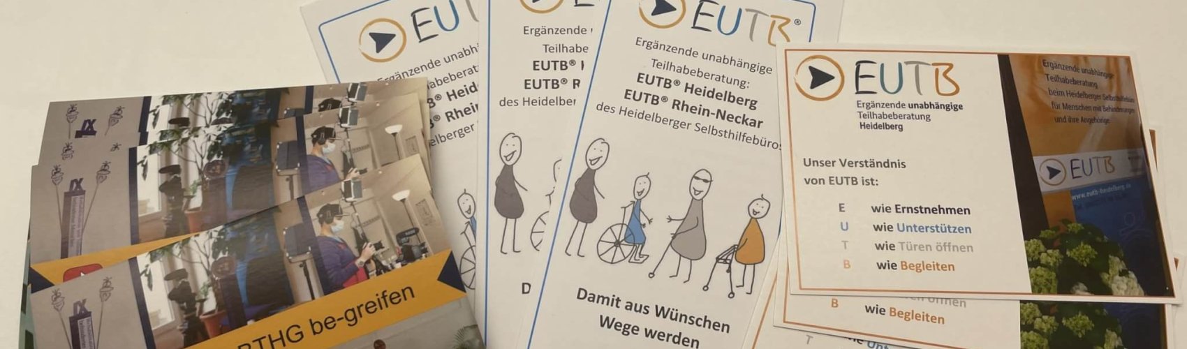 Zu sehen sind Postkarten und Flyer der EUTB Heidelberg und Rhein Neckar